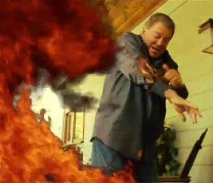 Man with Turkey Fryer that is on fire