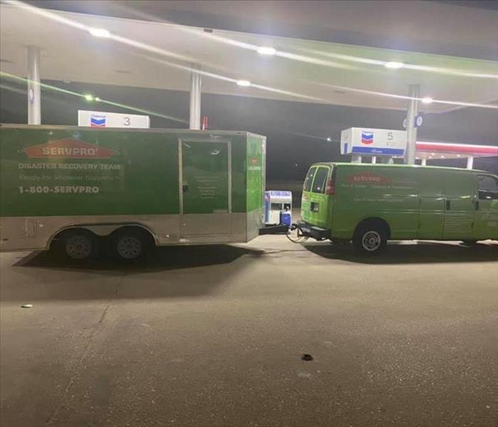 Van and Trailer at gas station